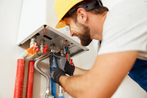 tech repairing a furnace