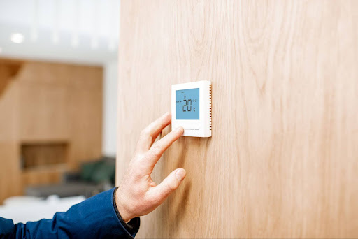 adjusting a home thermostat