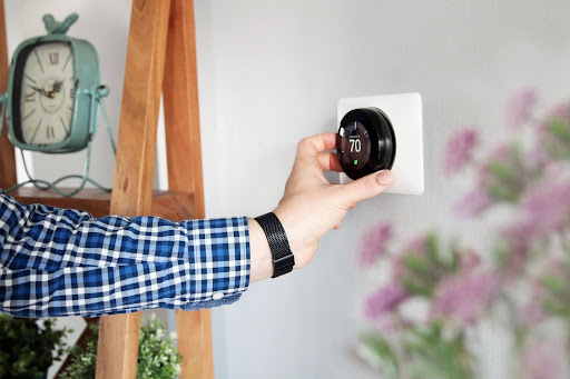 adjusting home thermostat